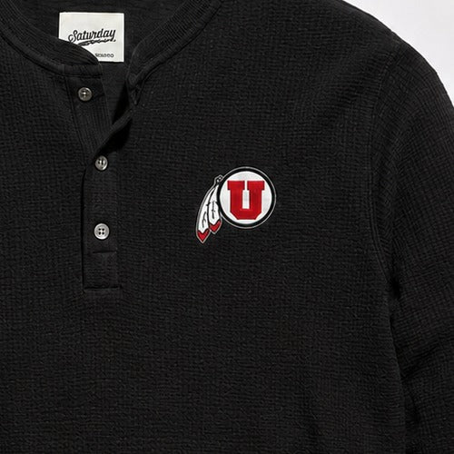 Three-button placket and embroidered drum and feather patch detail