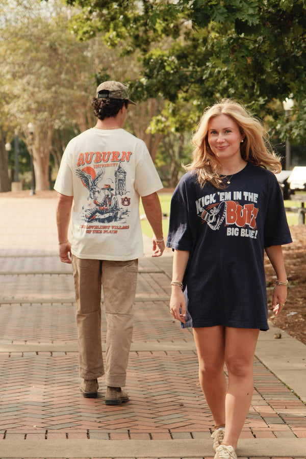 Ivory, walking on campus with the Kick 'Em tee